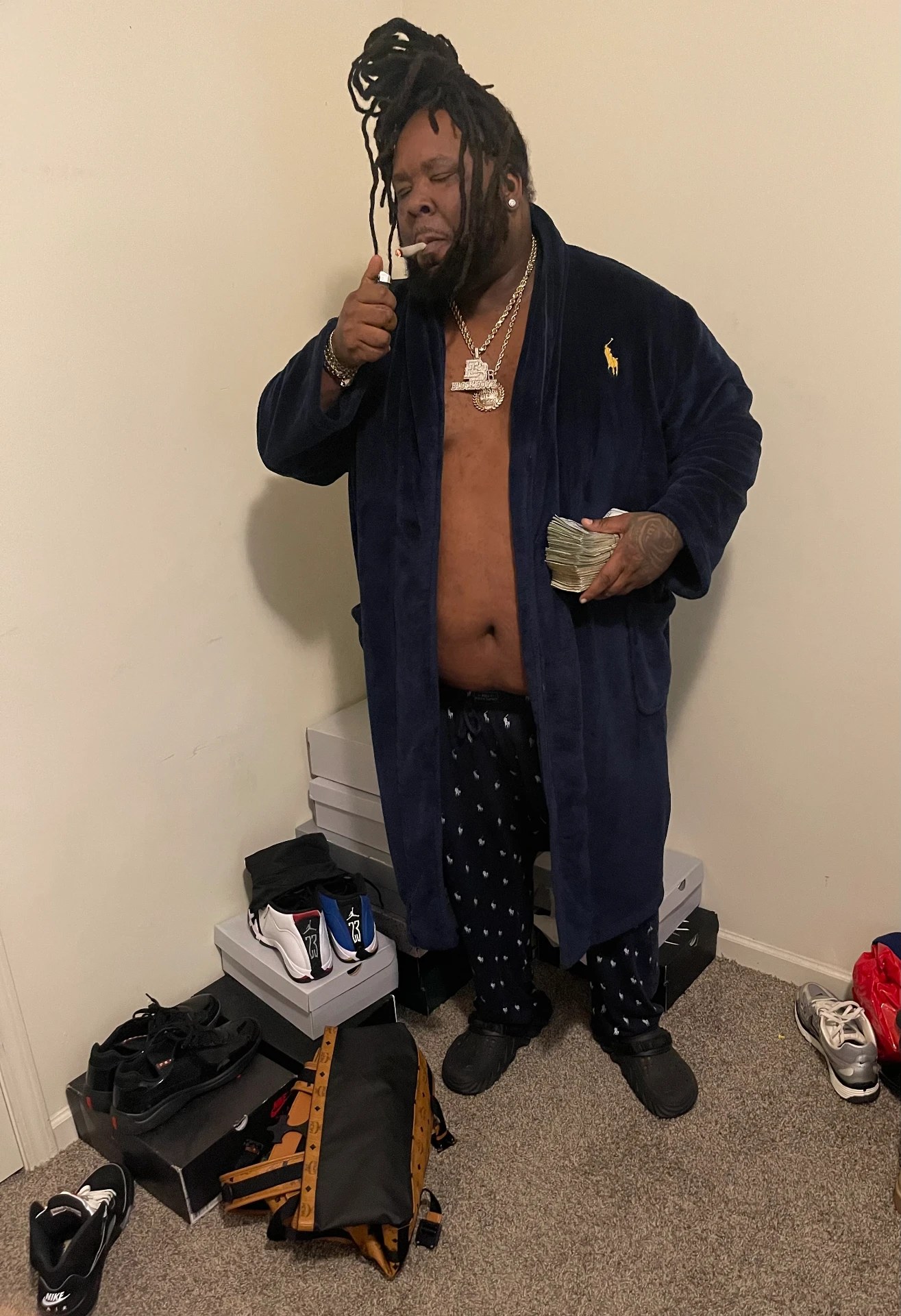 Blockboy Spanky press photo — robe, chain and cash